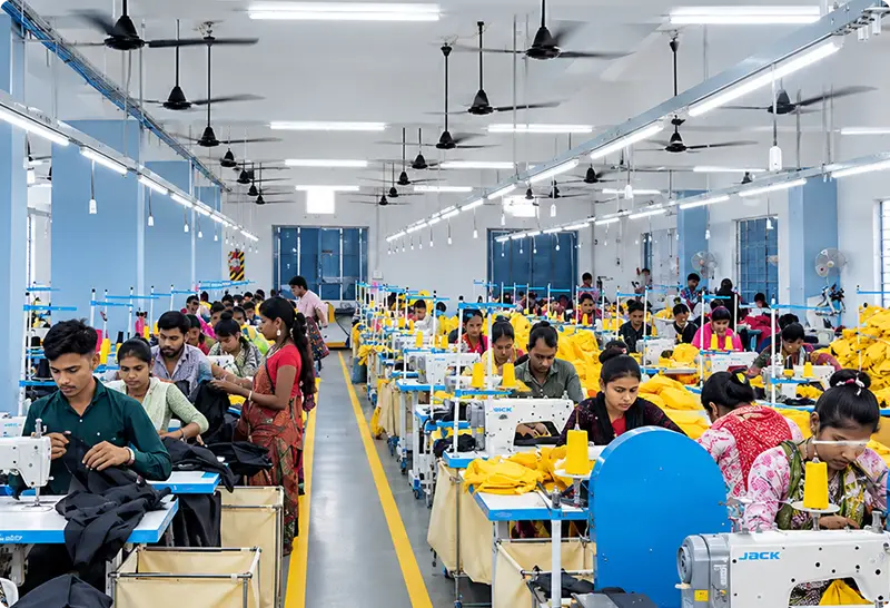 Workers on the Aashi factory production floor
