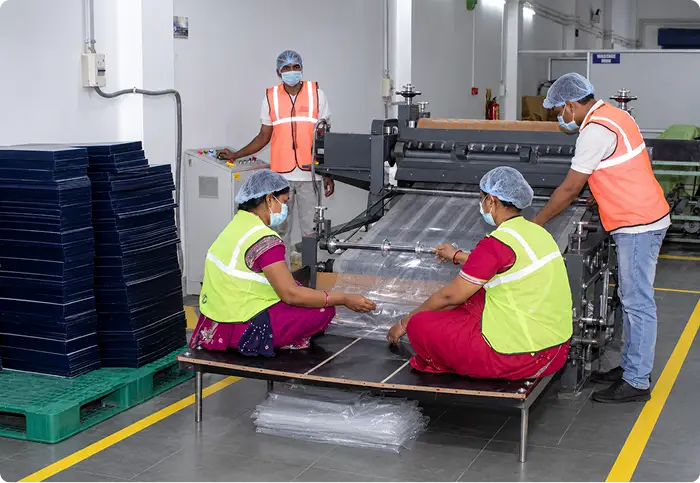 Factory workers handling materials in the warehouse